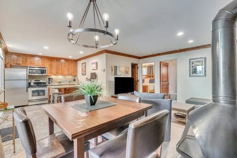 Alternate view of living, dining and kitchen area. New lighting & table seats 8.