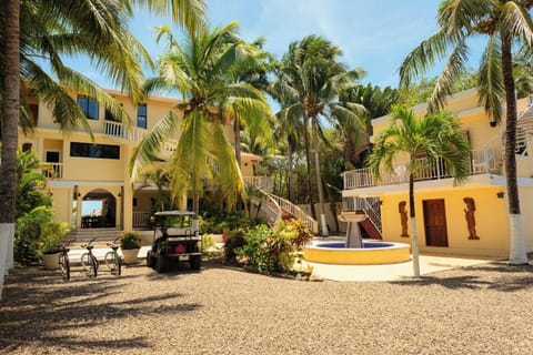 Front courtyard: Bicycles (left), Golf Cart (middle), staff house (right).