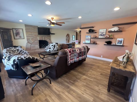 Living room has lots of comfortable seating, 50" HD TV & aux-enabled stereo