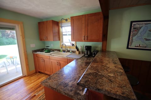 Kitchen, four burners, coffee maker, farm sink
