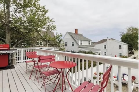 Sunny deck with gas grill.