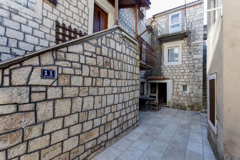 common square with table and chairs available to our tenants. house is number 13