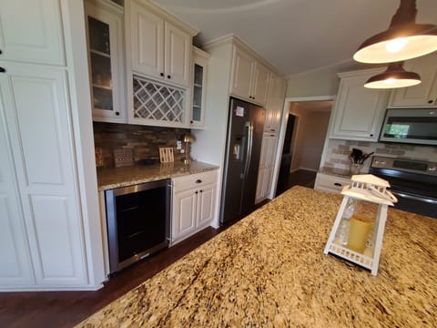 Kitchen has a Beverage Cooler