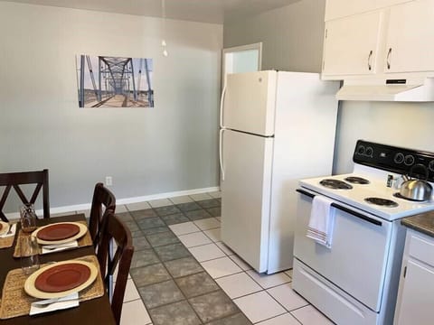 Our kitchen is equipped with a refrigerator, stove, toaster oven, and coffee pot.