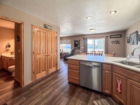 Spacious open-concept layout with cozy cabin charm and stunning lake views from every angle