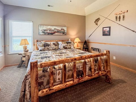Rustic retreat with lake views, cozy charm, and a handcrafted log king bed for restful nights