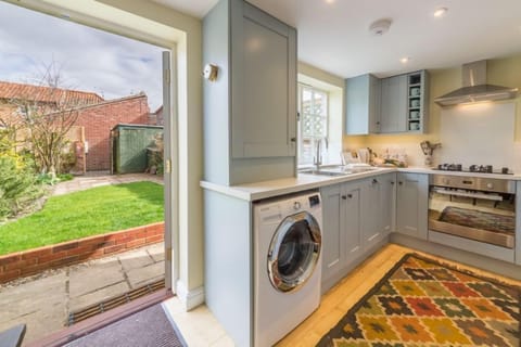 Ground floor: Kitchen with french doors leading into the garden