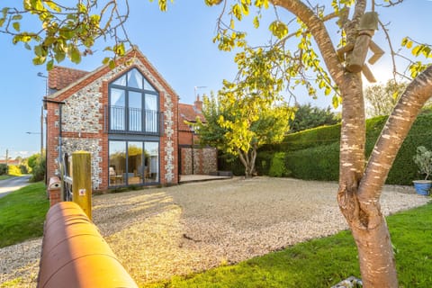 Plumtrees, Thornham: Juliet balcony that enjoys stunning vistas across Thornham's saltmarsh to the sea beyond