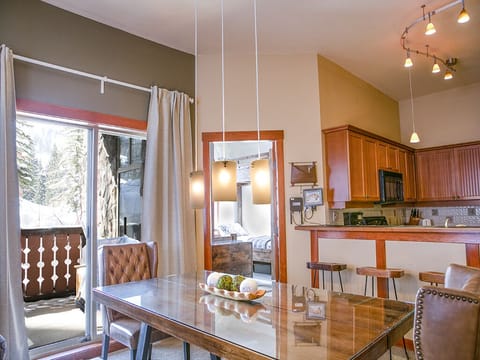 Dining Area - Dining area from the living room, showing table, looking into the twin bunk bedroom.