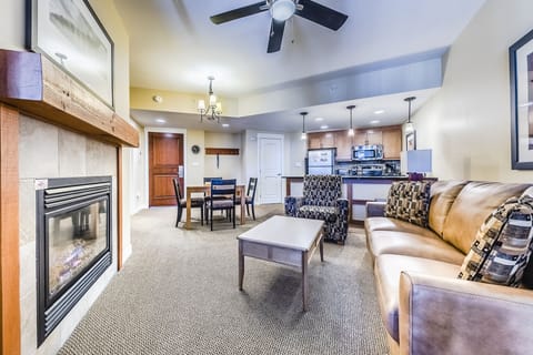 Living area - Brand new Queen sofa sleeper, gas fireplace, ceiling fan, and access to the private balcony.