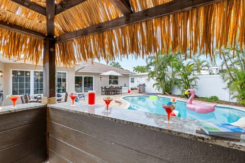 Outdoor Tiki Bar – A fun, tropical spot by the pool to serve drinks and hang out.