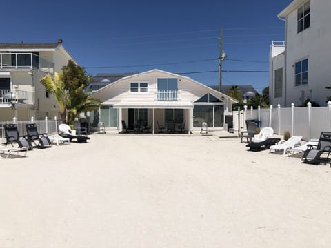 Back yard onto beach of Duplex,  North side is on left in picture.