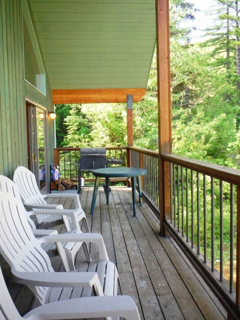 Big deck with charcoal bbq grill.