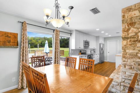 Sliding glass door out to the hot tub and pool