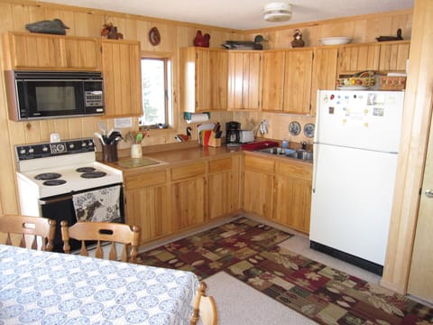Kitchen with plenty of kitchen tools for cooking and eating