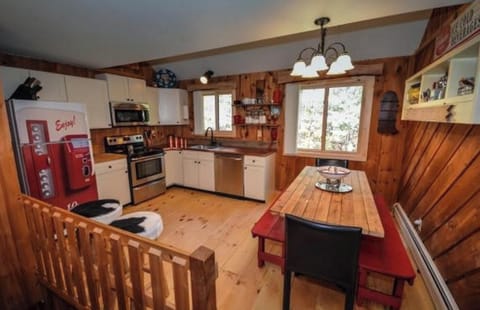 Kitchen w/ handmade table and copper countertops