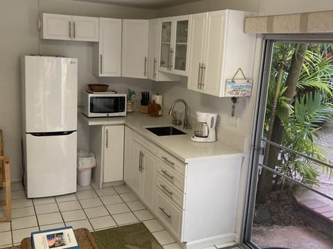 Palm Villa kitchen overlooking the pool and garden area