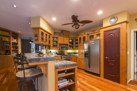 Kitchen with raised porcelain counter tops, dishes, cookware, coffee pot, etc.        