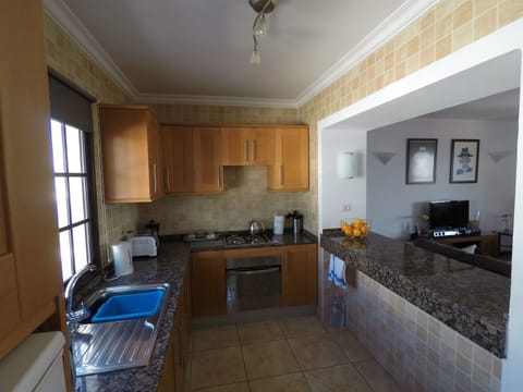 Recently fitted kitchen in Beech and Granite with serving area/worktop