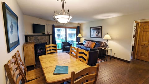 Living room with sofa bed, gas fireplace, and patio w/ propane BBQ grill