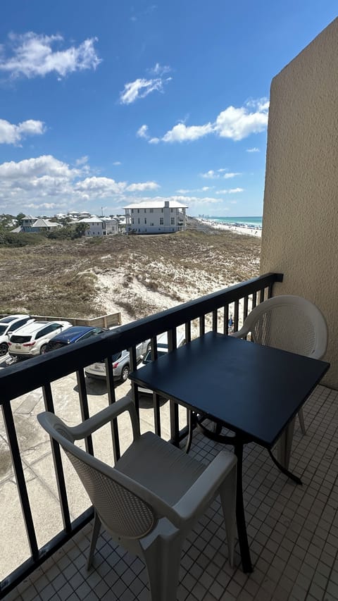 Our balcony, with patio table & chairs, offers views of Carillion Beach & Gulf.