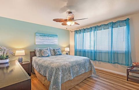 Relax in style in this charming bedroom designed with comfort and tropical elegance.
