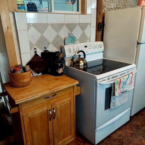 Full size range and refrigerator for your use.