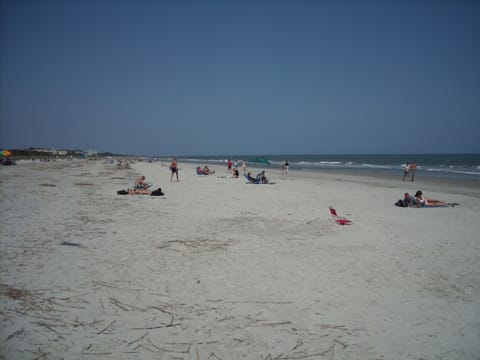 Lifeguards on beach.  Lots of sandbars.  Gradual long slope to deep water.