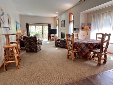 Large Living Room with Gas Fireplace and Sliding Doors to Large Deck