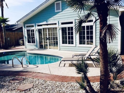 Escape to our backyard oasis to unwind and a take a dip in the pool.