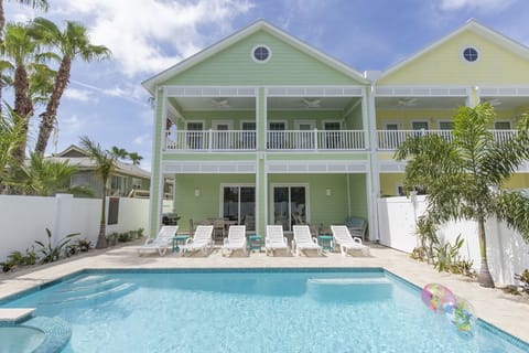 Welcome to 111A Capricorn, your spacious beach home with a private heated pool & hot tub.