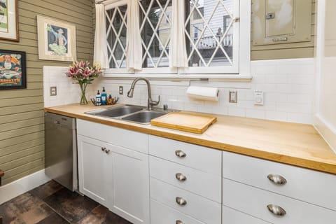 The kitchen is light and bright and well stocked for all your needs. 