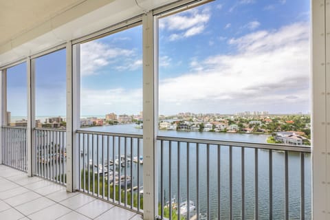 Your view of The Gulf of Mexico and Vanderbilt Bay from the screened Lanai