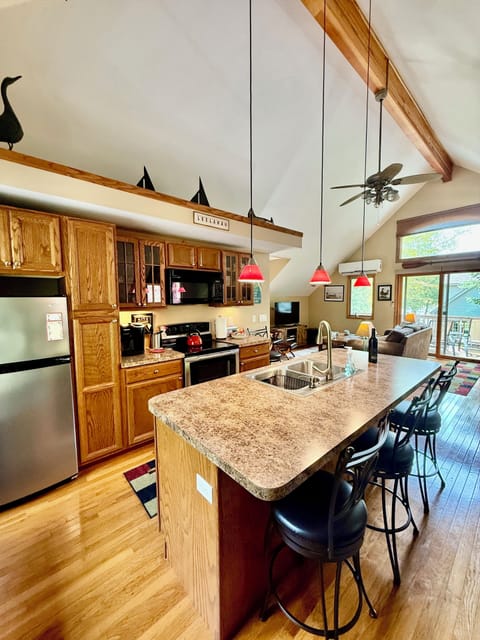 Complete with oven, microwave, coffee maker, and fridge.