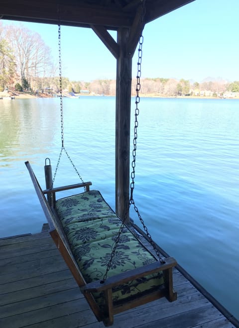 Porch swing on the dock - a great place to read a book or watch the swimmers