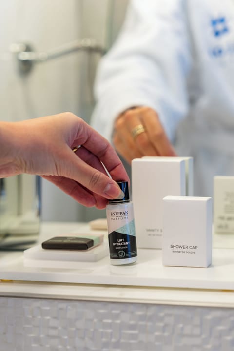 Designer toiletries, hair dryer, bathrobes, slippers