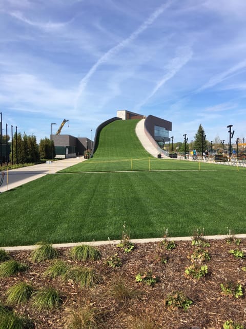 View of tubing hill from base of building at Titletown District Park; steps away