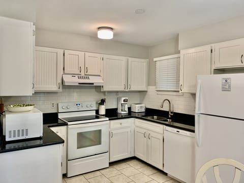 Enjoy cooking your meals in this fully stocked kitchen.