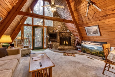 Enjoy a movie night around the grand, stone fireplace on the 55" HD Smart TV! 