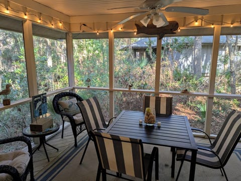 Screened-in patio overlooking the trees