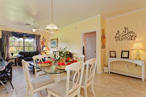 Tastefully decorated living & dining area  looking into lovely conservation area