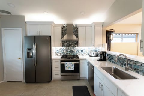 Remodeled kitchen small appliances include toaster, blender, Keurig, & auto drip