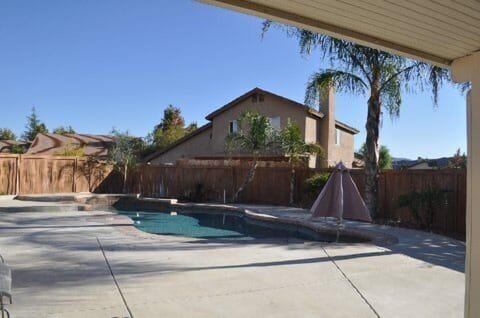 Backyard with pool. Pool is heated in winter months.