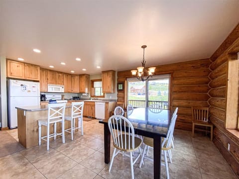 Rustic kitchen and dining area with scenic views, perfect for family meals and cozy gatherings