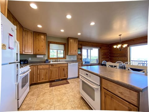 Warm, spacious kitchen with rustic charm and stunning views—perfect for cooking and gathering together.