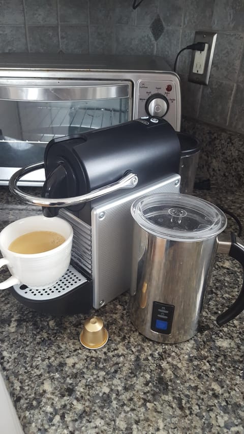 We have a Pixie Nespresso machine with a frother. Make your own fancy coffee.