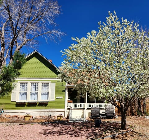 Front 1880s cottage, porch views of Pijes Peak.
Faces W Colorado Ave.  