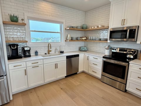 Gourmet fully stocked kitchen with ocean view. Lots of room to create a feast!