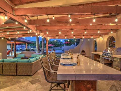 Backyard has a Bar, Fireplace, Lounge Area, Full Kitchen & Much More