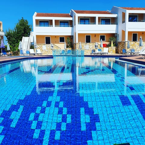 Outdoor pool, pool umbrellas, sun loungers